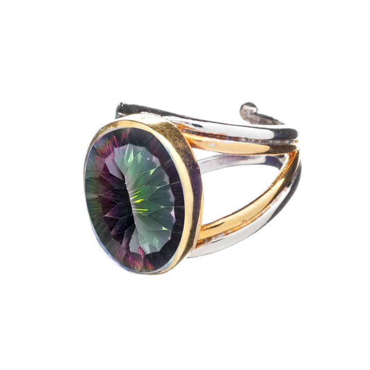The Dewberry Ring by Gallardo & Blaine Designs features a chunky sterling silver and gold vermeil band, set with a large round faceted gemstone in green and purple hues, shown against a white background.
