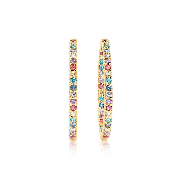 The Bovalino Hoop Earrings by Sif Jacobs feature thin gold plating and are embellished with blue, pink, and clear cubic zirconia gemstones, shown upright against a white background.
