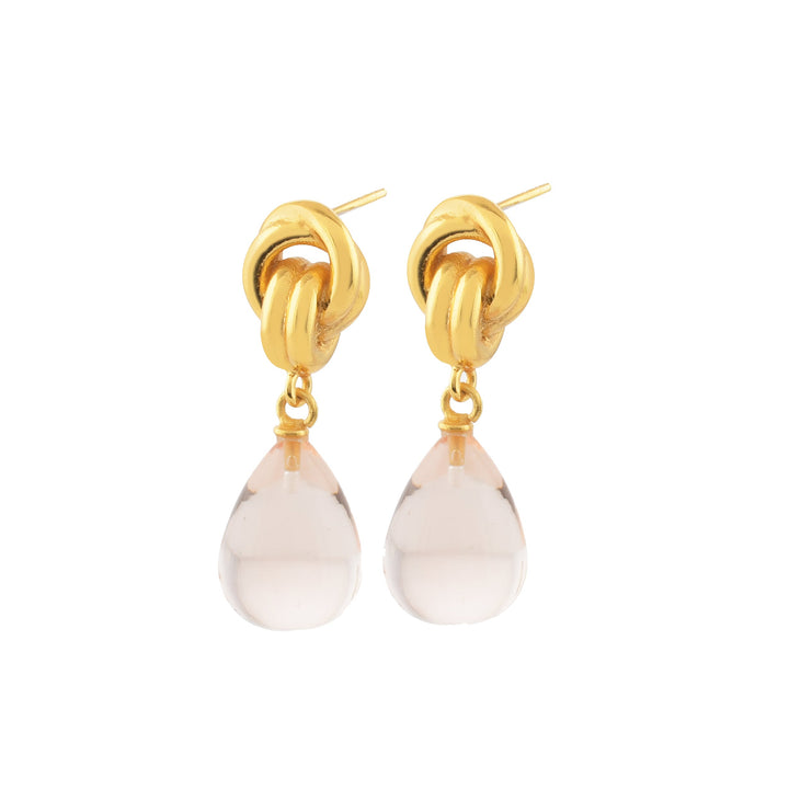 Introducing Shyla's Chunky Knot Earrings in various colors, featuring intricate looping gold knots at the top and clear, faceted glass teardrop pendants. These elegant and eye-catching earrings are crafted to be hypoallergenic, making them perfect for sensitive ears.
