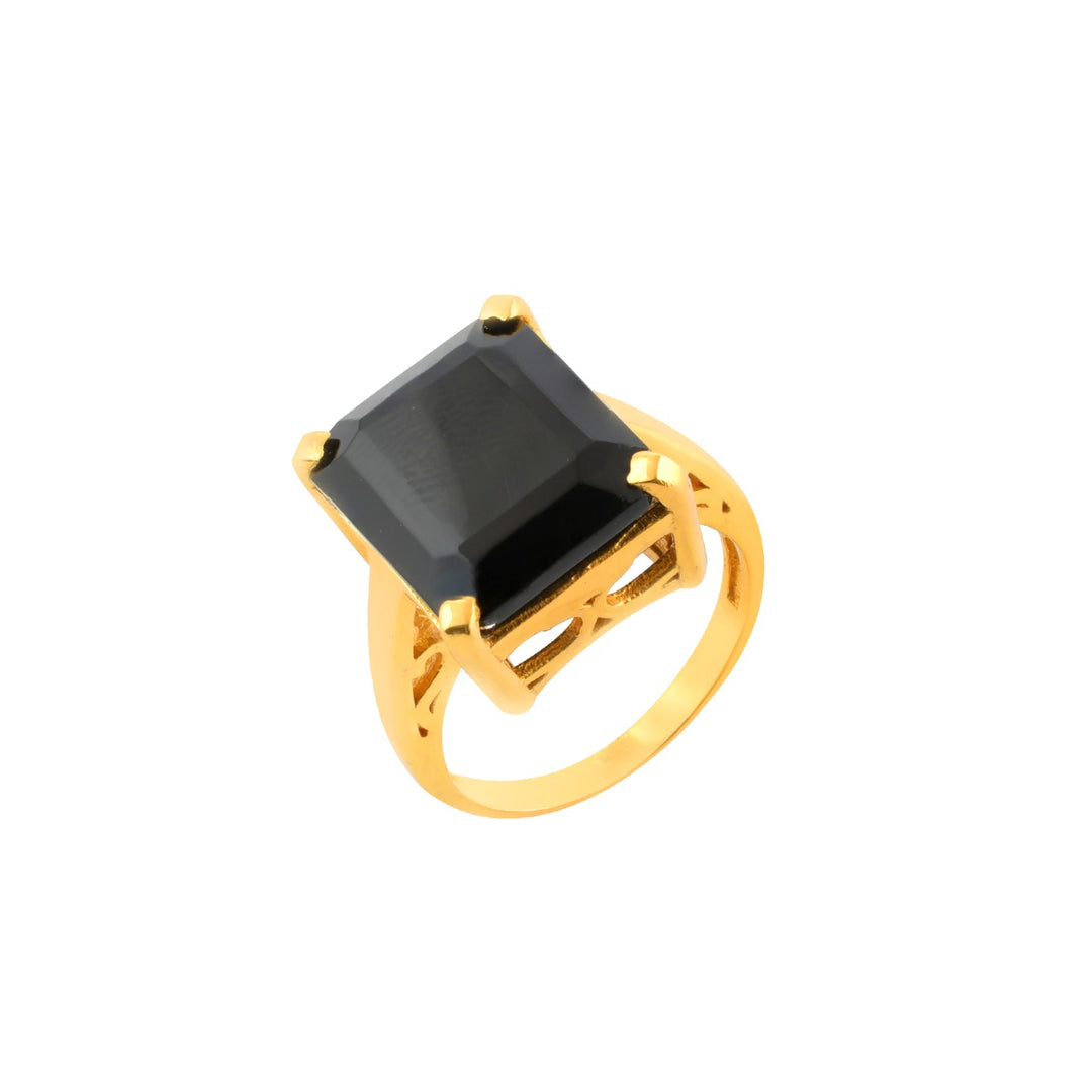 The Claudia Ring by Shyla is a gold chunky ring with a large rectangular black gemstone in a prong setting. Vintage inspired, it exudes timeless elegance and bold style, shown here on a white background.