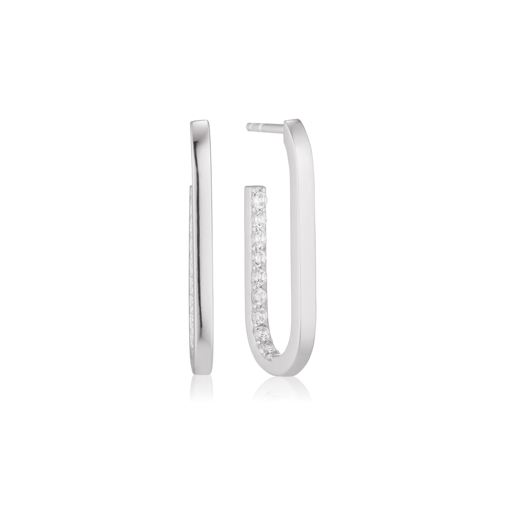 The Sif Jacobs Capizzi Medio Oval Hoop Earrings feature two polished 925 sterling silver hoops, with one hoop adorned by a row of sparkling diamonds on the front. Displayed against a white background.