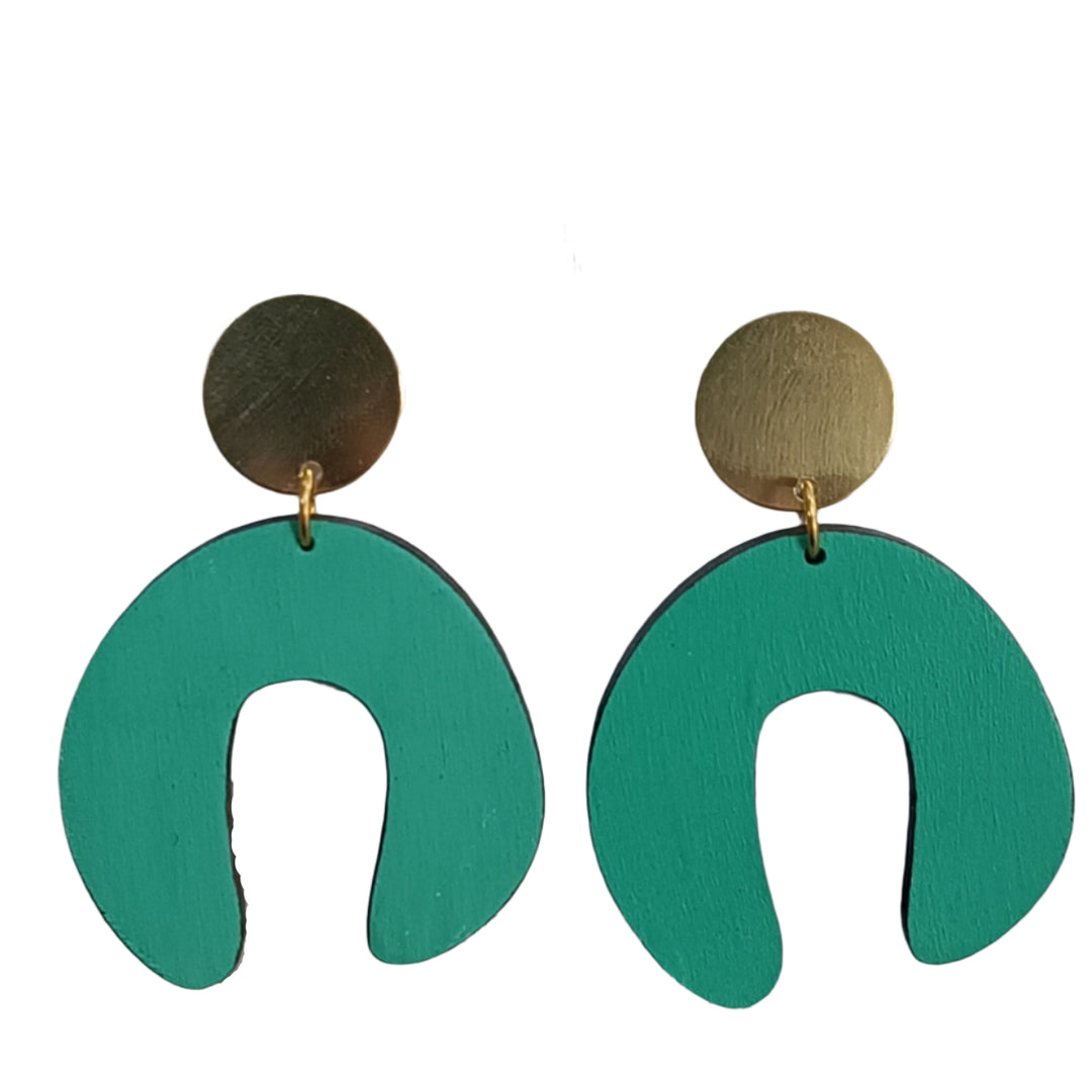 The D Doodle Earrings in Jade by Shock of Grey feature gold-tone studs and large green abstract U-shaped pendants, handcrafted in Dublin from laser-cut birchwood.