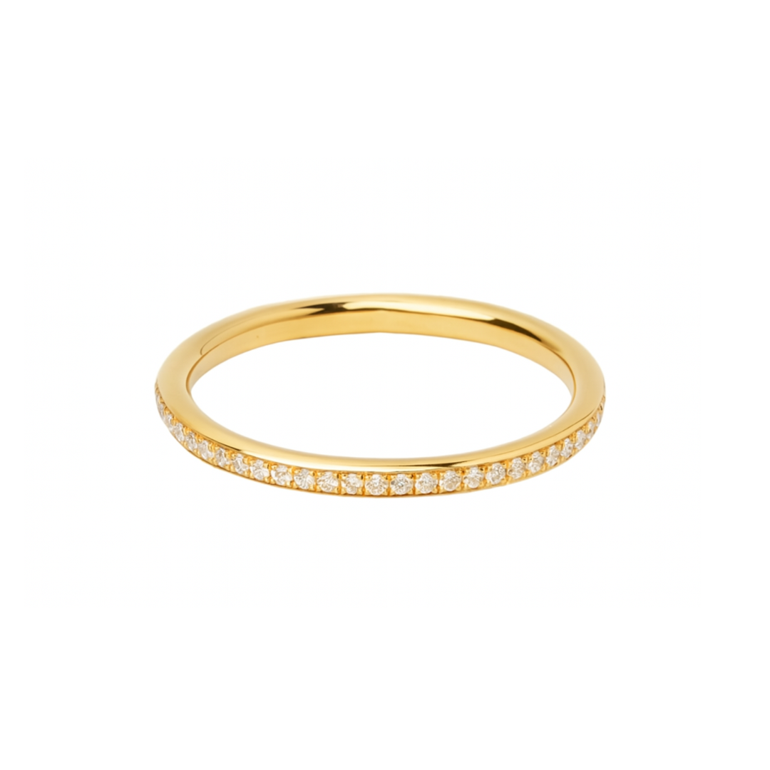 The Collective Dublin Dainty Half Eternity Wedding Ring features small, round lab grown diamonds pavé set in a continuous row along the top half of the slim gold band, shown against a plain white background.