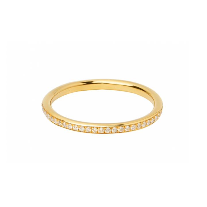 The Collective Dublin Dainty Half Eternity Wedding Ring features small, round lab grown diamonds pavé set in a continuous row along the top half of the slim gold band, shown against a plain white background.
