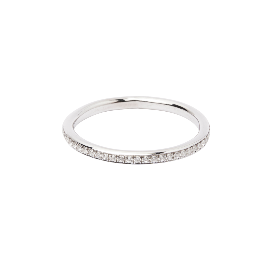 The Collective Dublin Dainty Half Eternity Wedding Ring features lab grown diamonds closely set along the top half of a slim silver band, shown against a white background.
