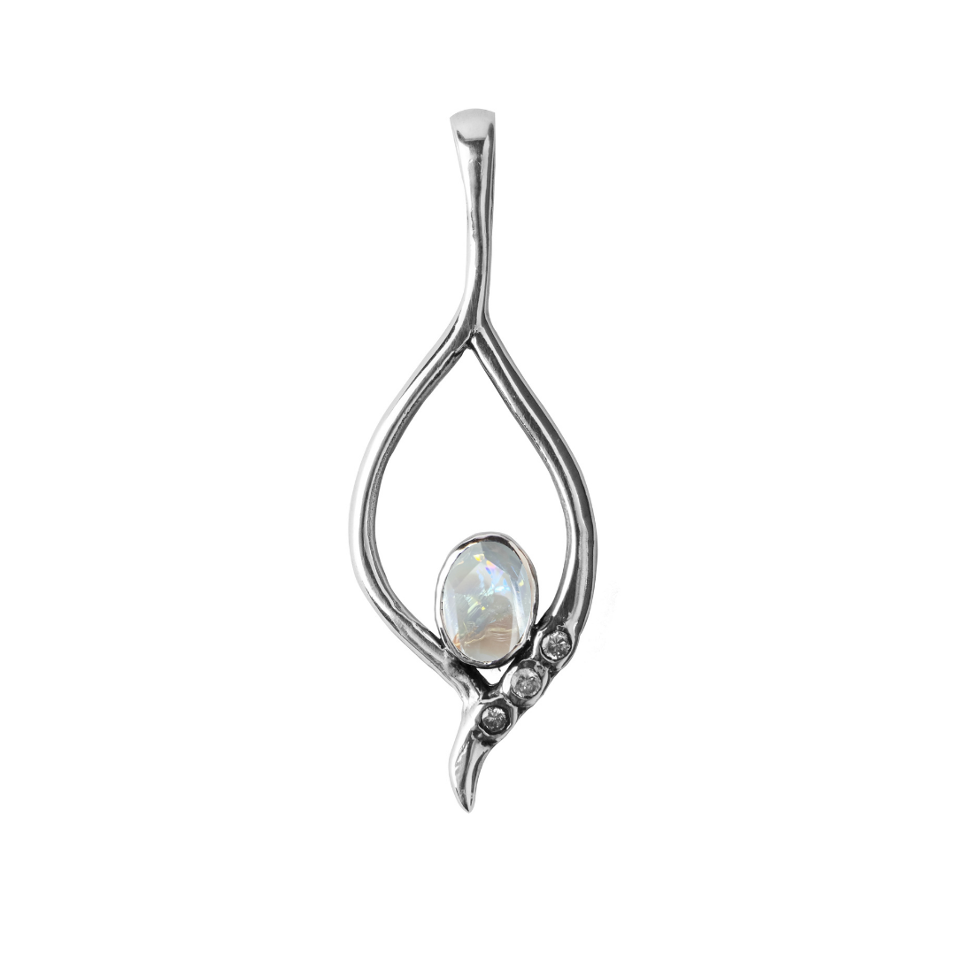 The Desert Star Pendant by Gallardo & Blaine Designs features an open teardrop design in sterling silver, showcasing an oval iridescent opal and three round accent stones on one side of the lower curve. Available in various gemstones.