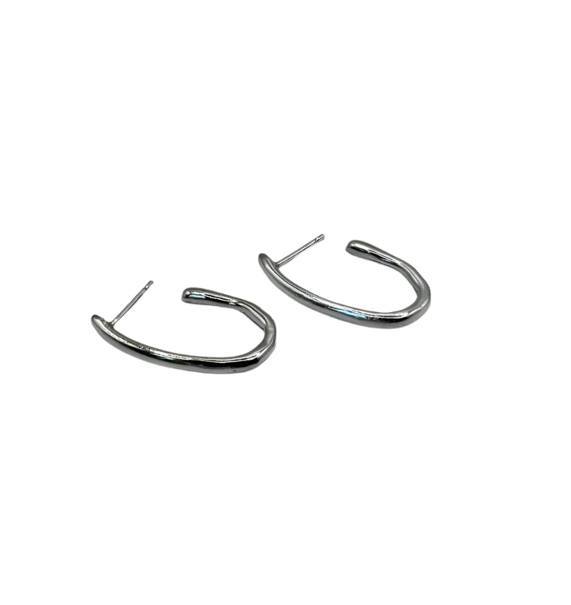A pair of Drop Organic Hoop Earrings by Inó Jewellery, featuring silver irregular shapes and straight posts from the Rustic Collection, displayed on a plain white background.