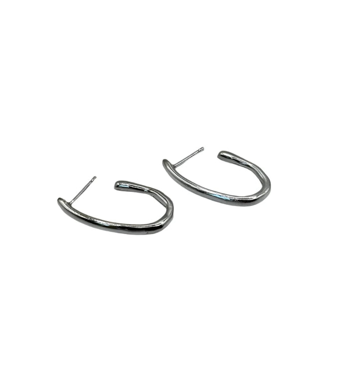 A pair of Drop Organic Hoop Earrings by Inó Jewellery, featuring silver irregular shapes and straight posts from the Rustic Collection, displayed on a plain white background.