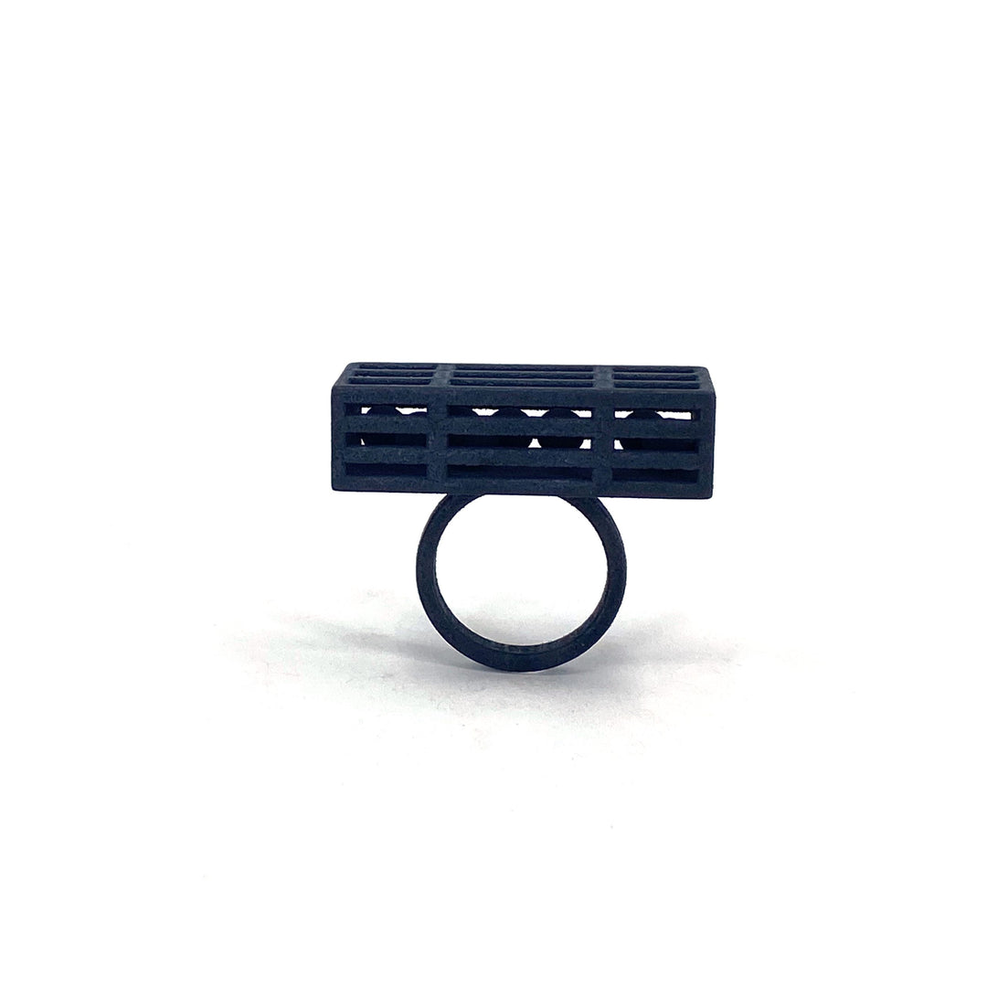The Elsiem Vibe Balls in Cage Ring is a black SLS nylon statement piece with a rectangular, hollow, grid-like top, showcased on a plain white background.