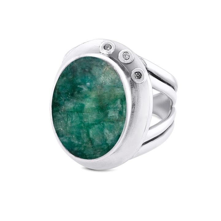 The Eyetelia Ring by Gallardo & Blaine Designs showcases a bold oval green gemstone flanked by three small round diamonds on a sterling silver gold vermeil band for an elegant, eye-catching touch.