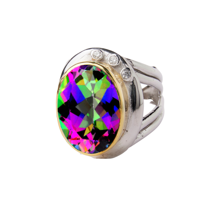 The Eyetelia Ring by Gallardo & Blaine Designs features an oval, multicolored faceted gemstone with three clear stones above it, set in sterling silver gold vermeil. Shown against a white background.