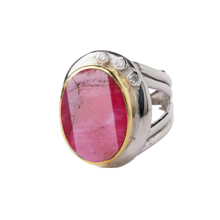 The Eyetelia Ring by Gallardo & Blaine Designs features a large oval pink gemstone set in sterling silver gold vermeil, accented with three small round diamonds on the band.