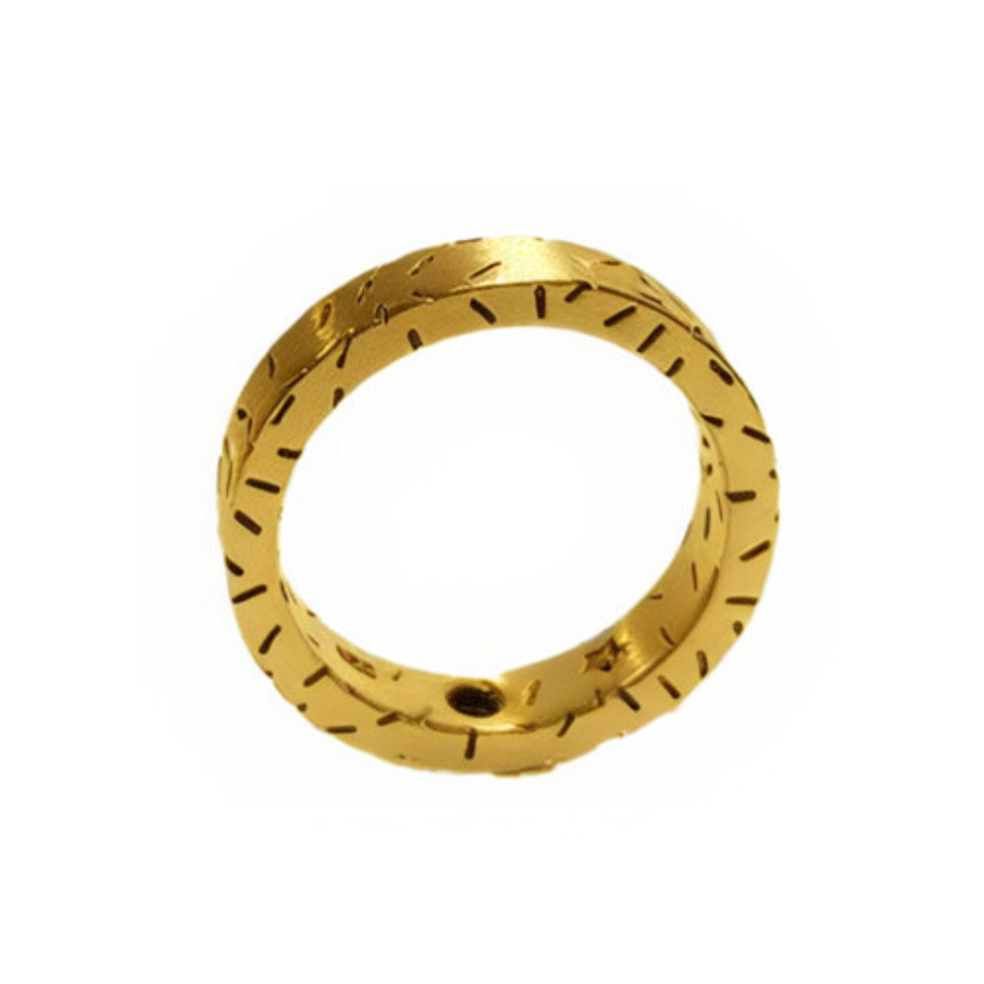 The Fruit Bijoux Dashes Ring, crafted in 24ct gold-plated metal, features engraved lines and a small hole near the base, elegantly showcased against a plain white background.