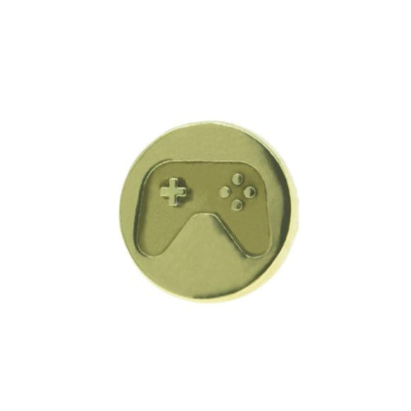 The Millett Wade Gamer Lapel Pin is a gold-colored round pin with an embossed video game controller, plus-shaped D-pad, and four buttons—ideal for unique pin collectors.