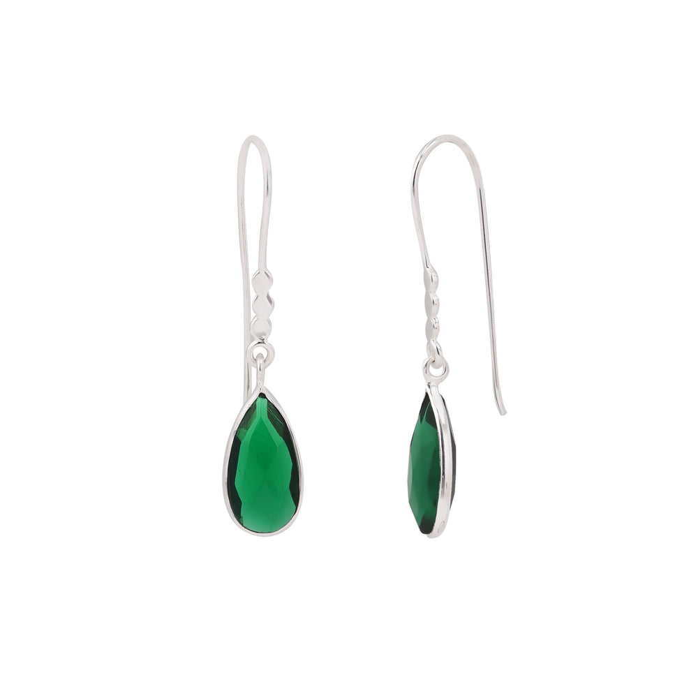 Simple silver drop earring with teardrop shaped, emerald green stones. Pictured here against a white backdrop with one earring turned to the side and the other forward facing.