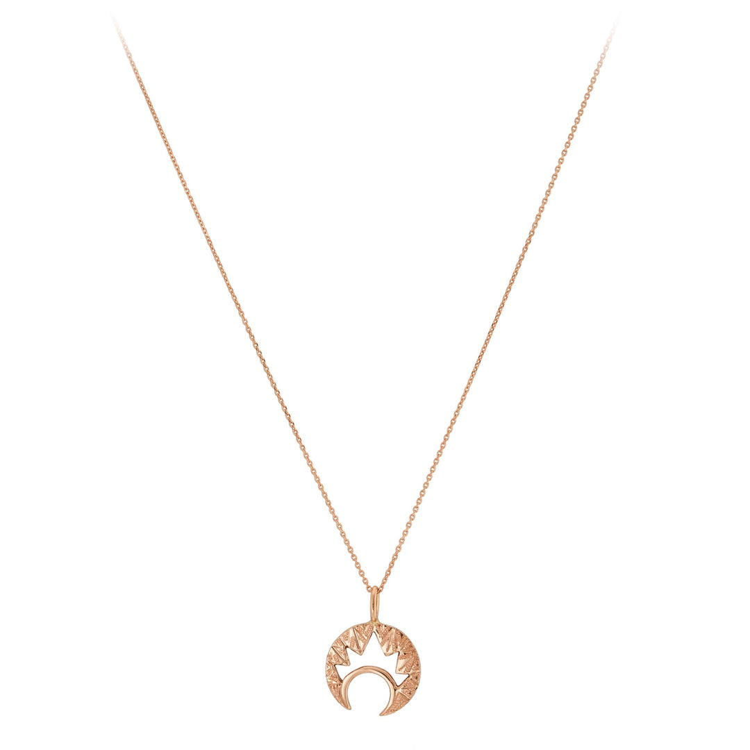 The Cosmic Boulevard Moon & Moon 9ct Gold Pendant, available in yellow or rose gold, features a crescent moon and hand-engraved sunburst on a fine chain—crafted in Dublin and shown on a white background.