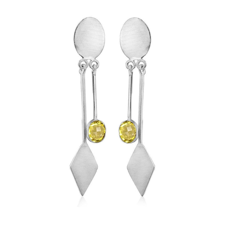 Gallardo & Blaine Designs' Karo Earrings feature modern elegance in silver with a yellow gemstone, hanging from an oval stud above two geometric shapes, including a diamond.