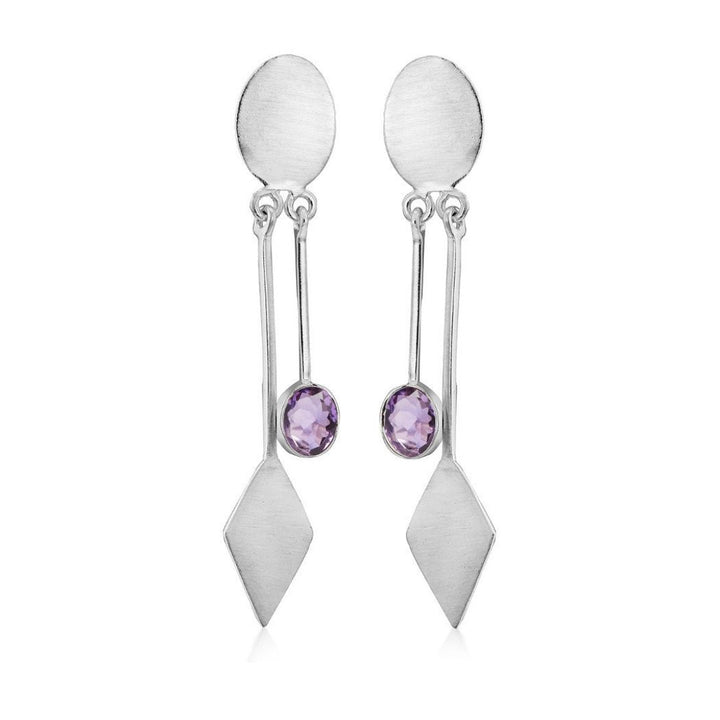 Introducing Gallardo & Blaine Designs' Karo Earrings, a blend of modern elegance and timeless style. These silver dangle drop earrings feature an oval top, a long vertical bar with a diamond shape at the bottom, and centrally set round purple gemstones.