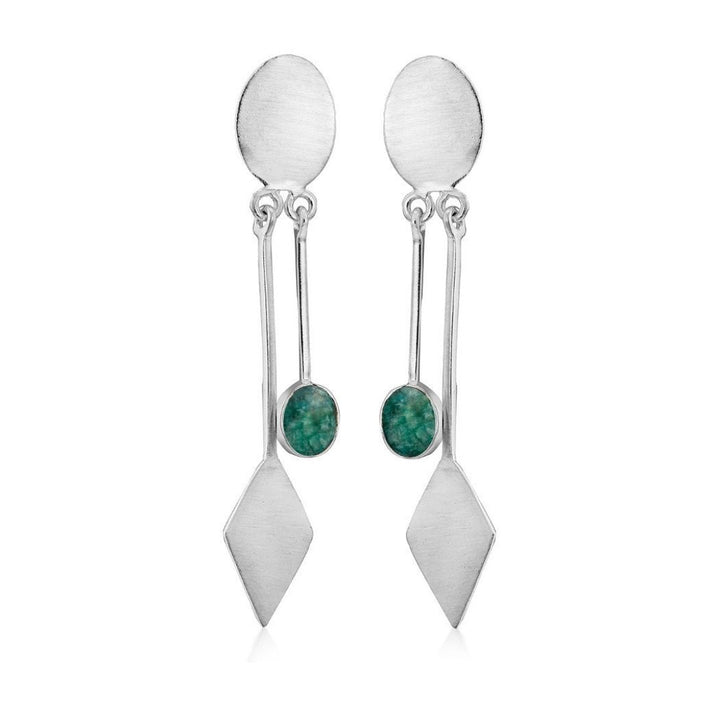 The Karo Earrings by Gallardo & Blaine Designs showcase modern elegance with an oval stud, a kite-shaped charm, and a green stone on a thin dangling silver chain, highlighting their sophisticated allure. Available in various gemstones.