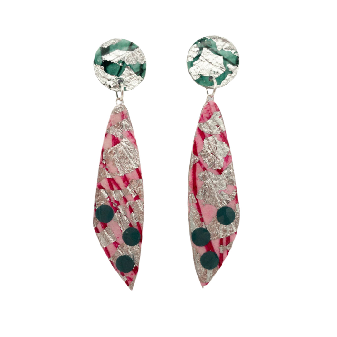 A pair of Rothlú Moondrifter Sgraffito Textile Earrings in Silver/Pink/Jade with a circular top portion in green and hypoallergenic plated silver foil. The earrings feature elongated teardrop-shaped dangles in pink, silver, and green polka dot patterns, creating a colorful and artistic design against a plain white background.