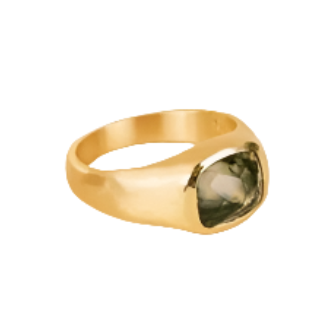 Goldplated ring with a green gemstone on a white background