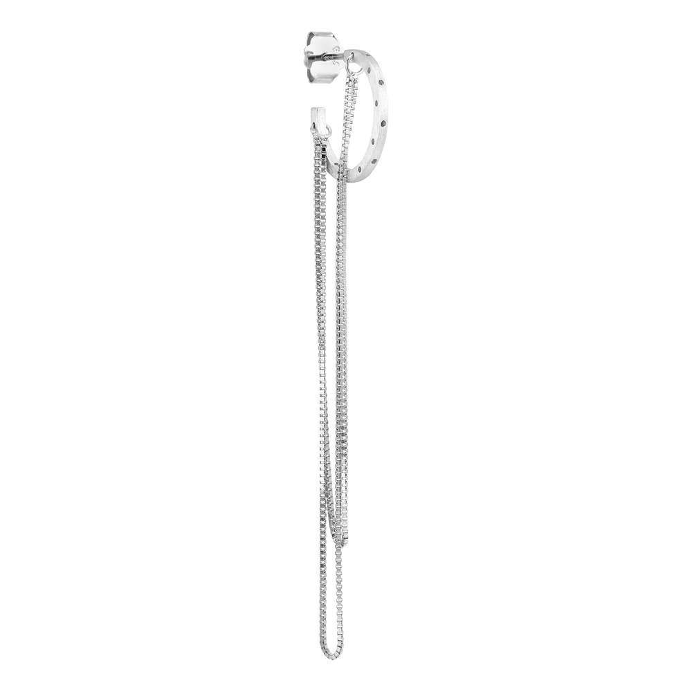 The Orbis Chain Hoop by Jane Koenig is a sterling silver ear cuff with delicate chain strands hanging from a small stud, showcasing minimalist modern design against a plain white background.