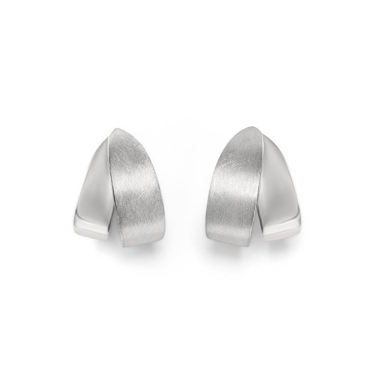 The Origata Studs by Gallardo & Blaine Designs are modern sterling silver earrings featuring a smooth, curved design with a matte finish, shown on a plain white background.