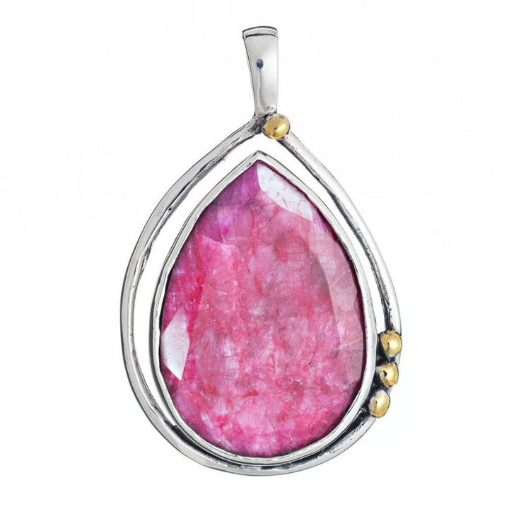 The Poppy Pendant Large by Gallardo & Blaine Designs features a teardrop-shaped pink gemstone in sterling silver, accented with three small gold details on one side, shown against a white background.
