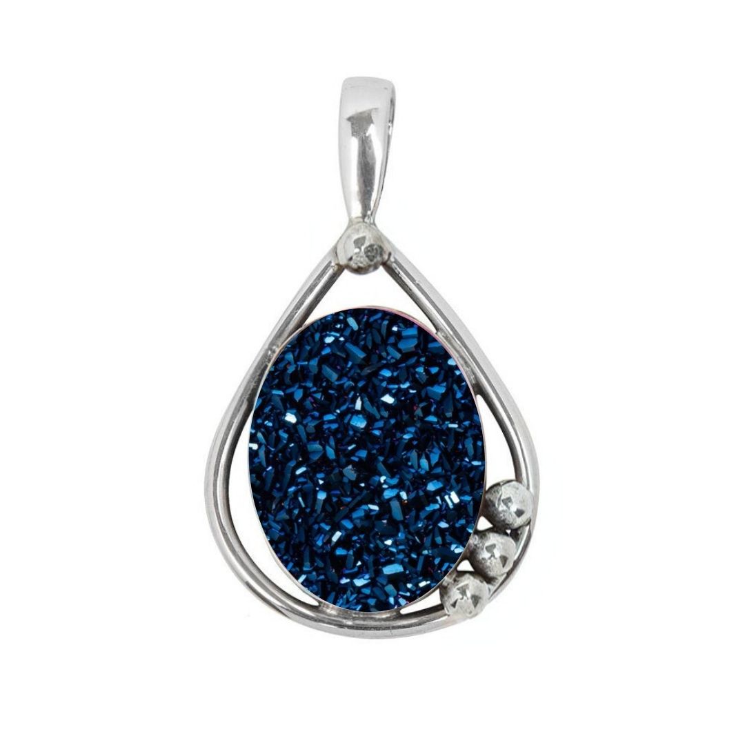 The Poppy Pendant Small by Gallardo & Blaine Designs features a teardrop shape in sterling silver and gold, with an oval deep blue gemstone center and three small silver spheres accenting the base.