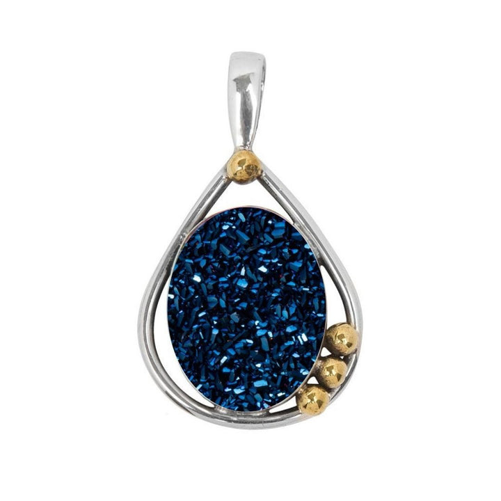 The Poppy Pendant Small by Gallardo & Blaine Designs is a sterling silver teardrop pendant with a textured oval blue gemstone center, accented by three gold spheres.