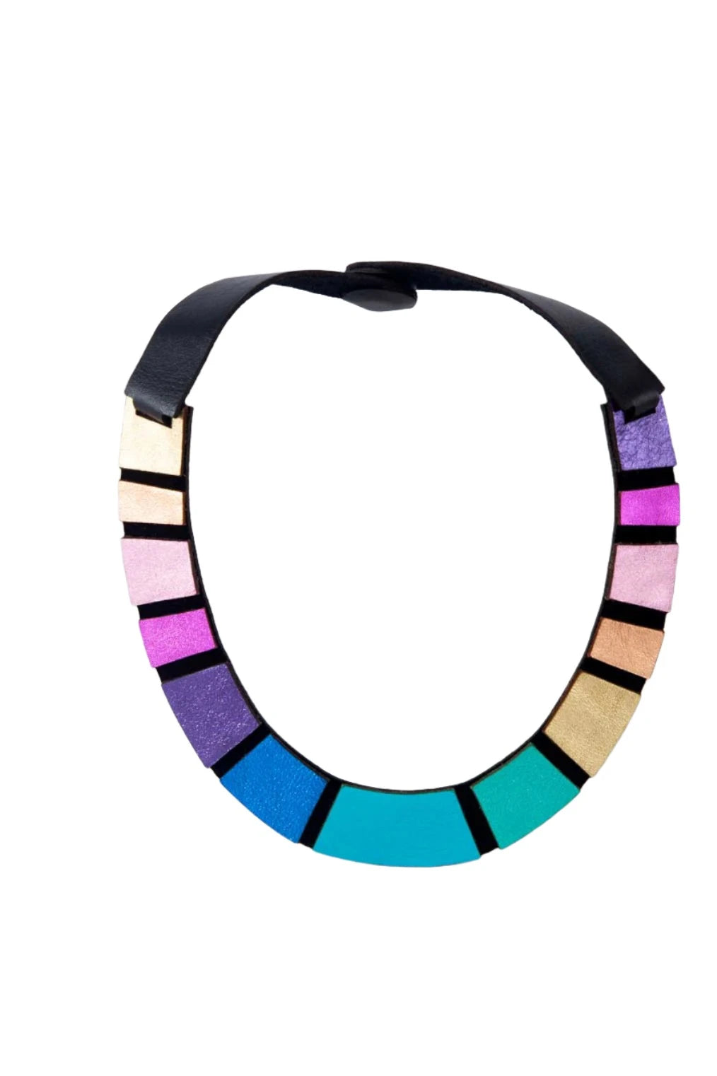 The Rainbow Leather Necklace by Iskin Sisters is a vibrant, lightweight accessory featuring a black band adorned with colorful rectangular blocks. These blocks transition through shades of purple, pink, gold, turquoise, and blue. Crafted from premium Argentinian leather, this semicircular necklace showcases a stunning geometric design and bold colors.