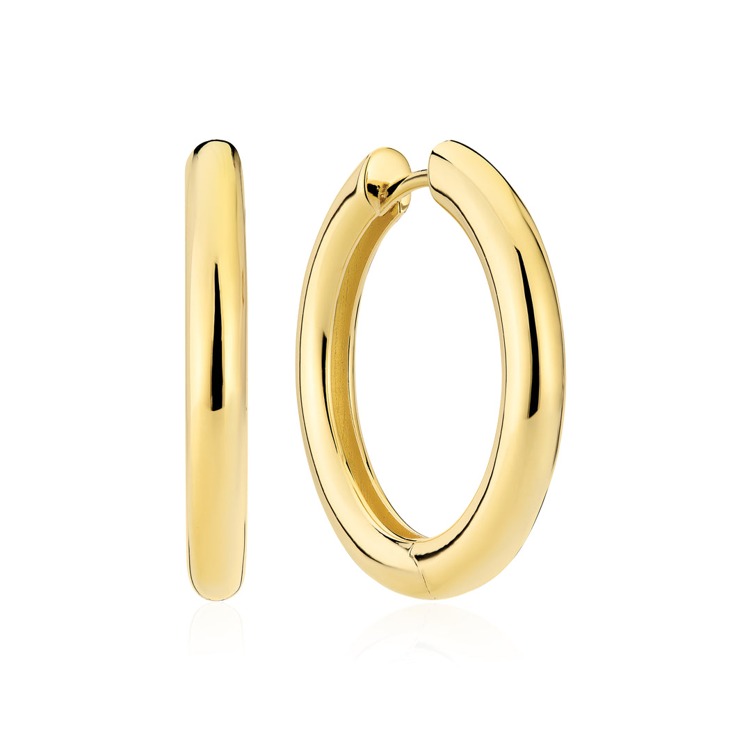 The Sif Jacobs Carrara Pianura Earrings, polished yellow gold hoops, are displayed from front and side angles against a white background—a striking piece for any gold plated jewellery collection.