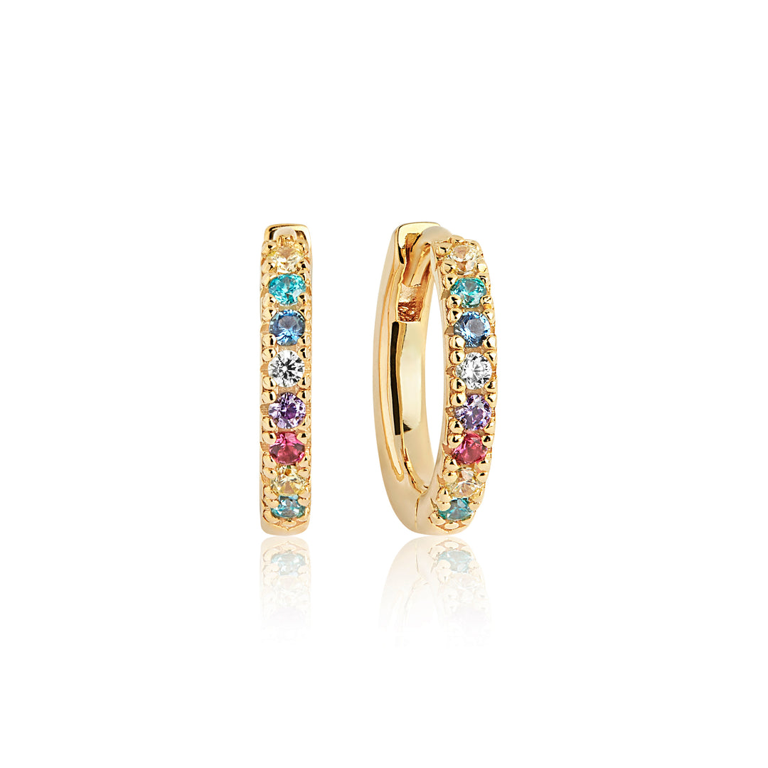 The Sif Jacobs Ellera Medio Hoop Earrings feature small cubic zirconia, sparkling in blue, pink, yellow, purple, and clear stones set in 18k gold plated sterling silver. The demi-fine pieces are displayed upright against a white background.