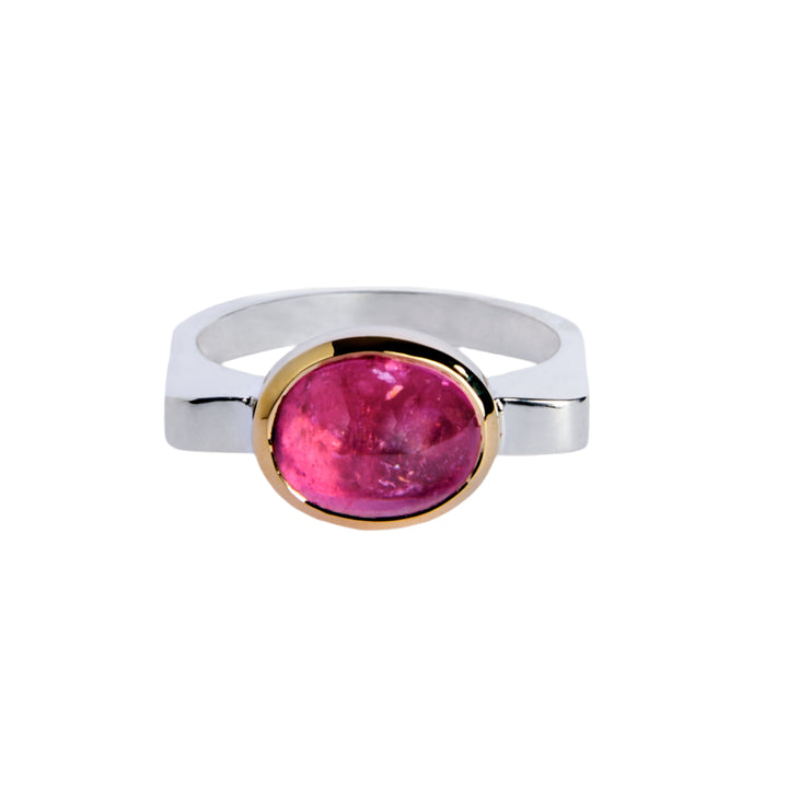 Silver ring with pink tourmaline in 9ct yellow gold bezel . The top of the ring is rectangular making the band D shaped.