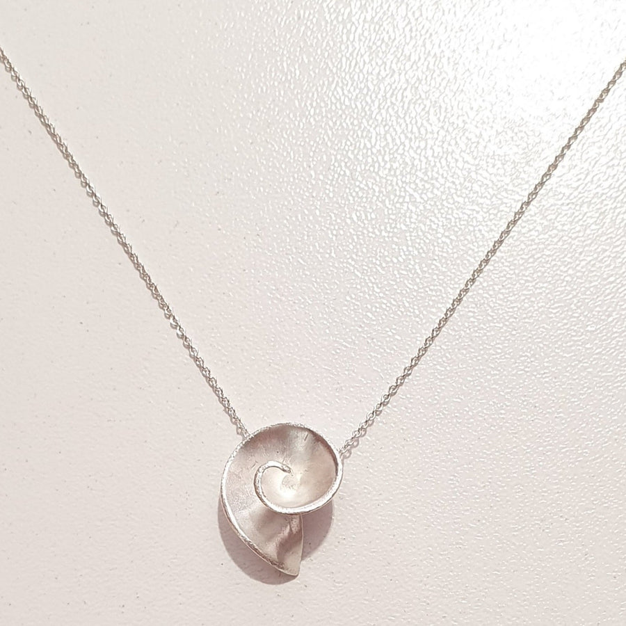 Small Swirl necklace in sterling silver or gold plated silver on a 16" chain.
