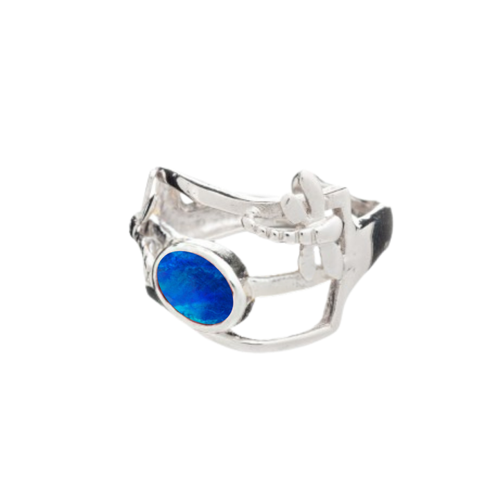 The Small Dragonfly Ring by Gallardo & Blaine Designs features an open, organic design with a blue oval gemstone set on one side, elegantly crafted in silver and gold plate.