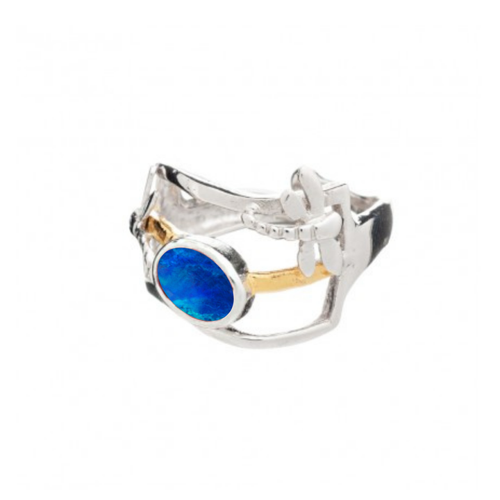 The Small Dragonfly Ring by Gallardo & Blaine Designs features an abstract silver and gold plated band, a bright blue oval gemstone centerpiece, and a delicate dragonfly detail—a unique gemstone jewelry piece.