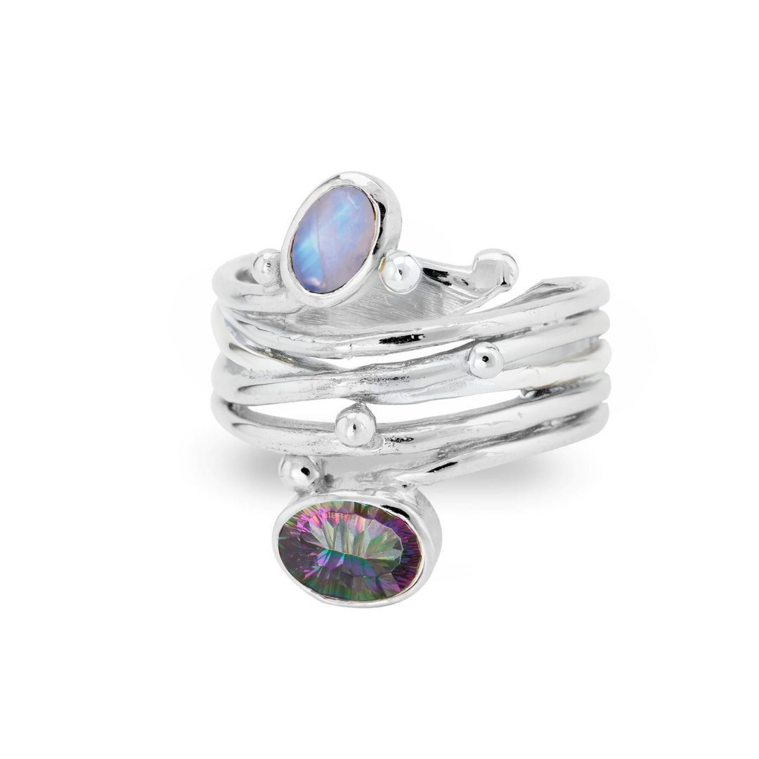 The Snake Ring in Silver Gold & various gemstones by Gallardo & Blaine Designs features adjustable overlapping bands, silver spheres, an oval iridescent stone on top, and a larger colorful gemstone below.