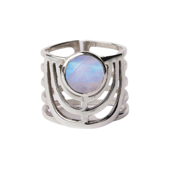 The Solar Ring by Gallardo & Blaine Designs features a wide sterling silver band with an open geometric design and a large round iridescent gemstone at the center—an eye-catching statement piece available in various gemstones.