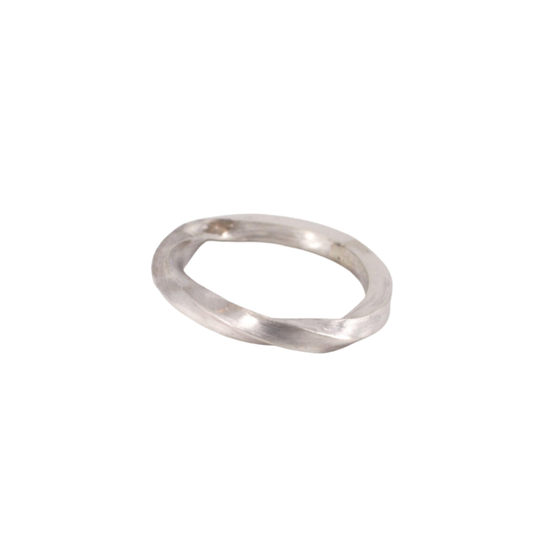 The MarCucurella Torn Silver Ring features a handmade, slightly irregular twisted design, shown on a plain white background.