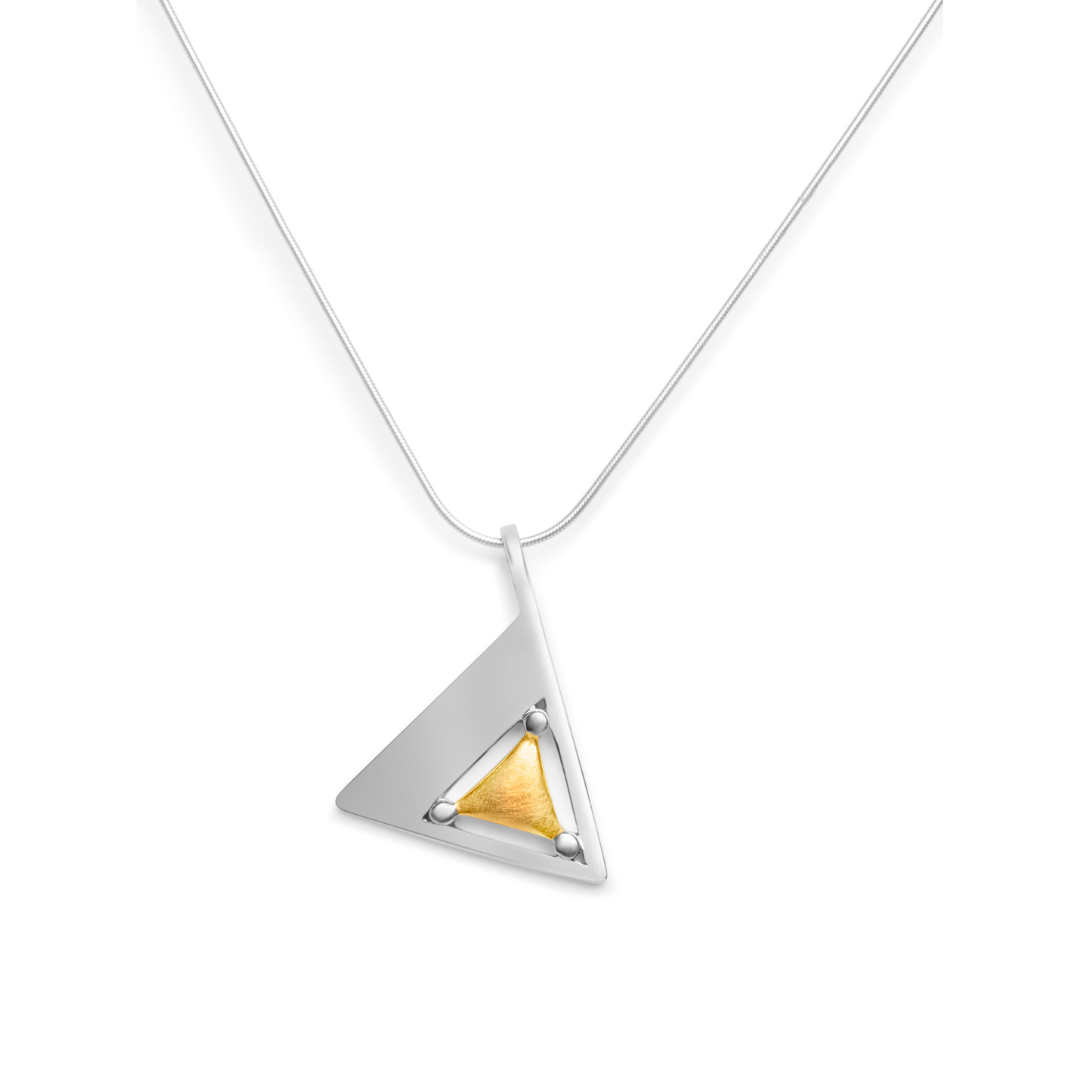 The Triune Pendant & chain by Gallardo & Blaine Designs features a sterling silver necklace with a triangle pendant, accented by a gold vermeil inset and secured by four prongs, hanging from a delicate silver chain.
