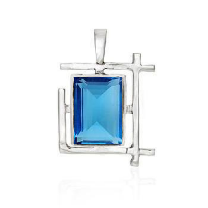 The Art Deco Pendant by Gallardo & Blaine Designs features a modern geometric sterling silver frame with a large rectangular blue gemstone centerpiece. Available in various gemstones.