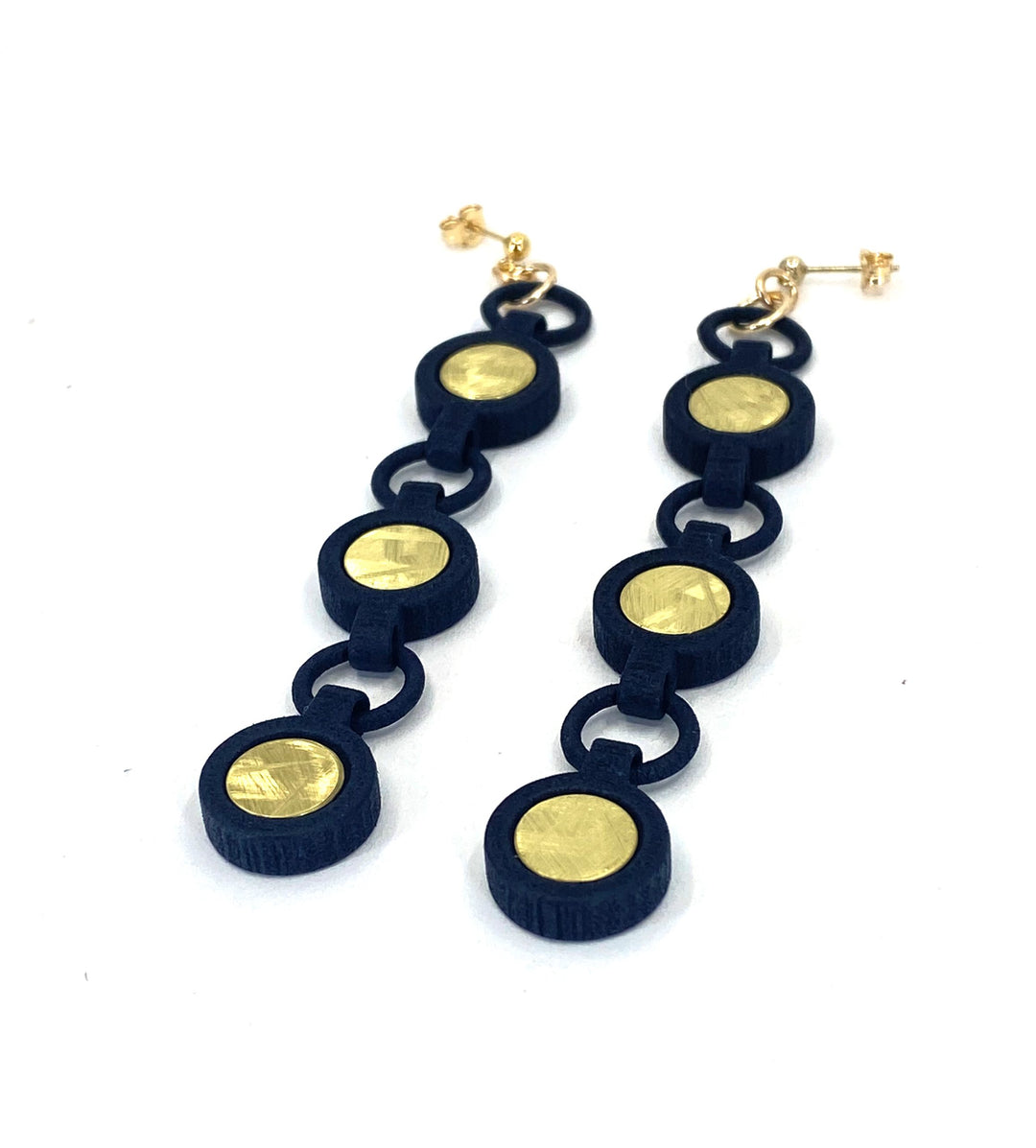 The Elsiem Vibe 3 Drop Earrings feature three linked black circles with gold centers on gold filled posts, shown against a white background.