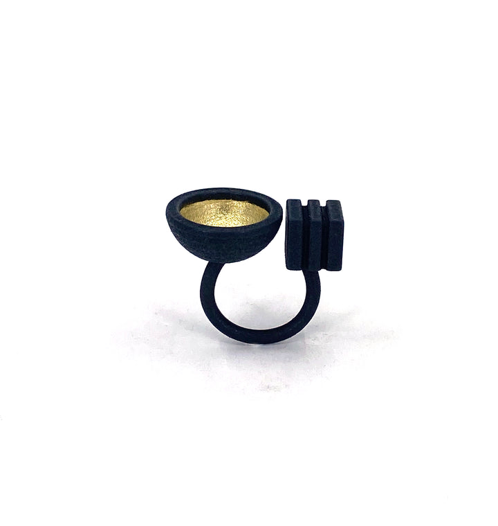 The Elsiem Vibe Gold Dome & Cube Ring features a modern, sculptural design with a wide gold dome top and two rectangular black accents, shown on a white background.