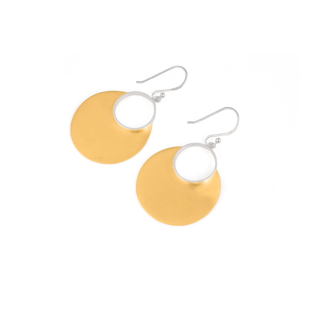Mixed metal drop earrings. Small silver hoop with large, drooped, gold plated, semi circle beneath. pictured here lying flat on a white backdrop