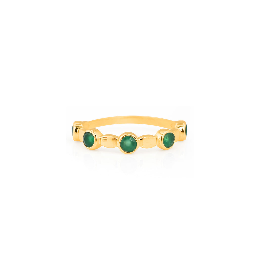 Gold plated ring with gold oval features and intermittent green onyx stones in a gold plated bezel.