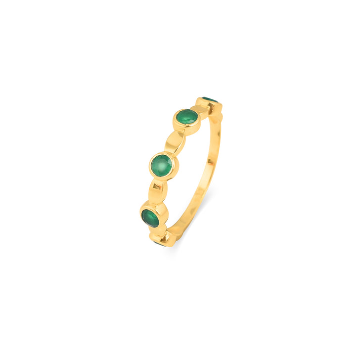 Gold plated ring with gold oval features and intermittent green onyx stones in a gold plated bezel.
