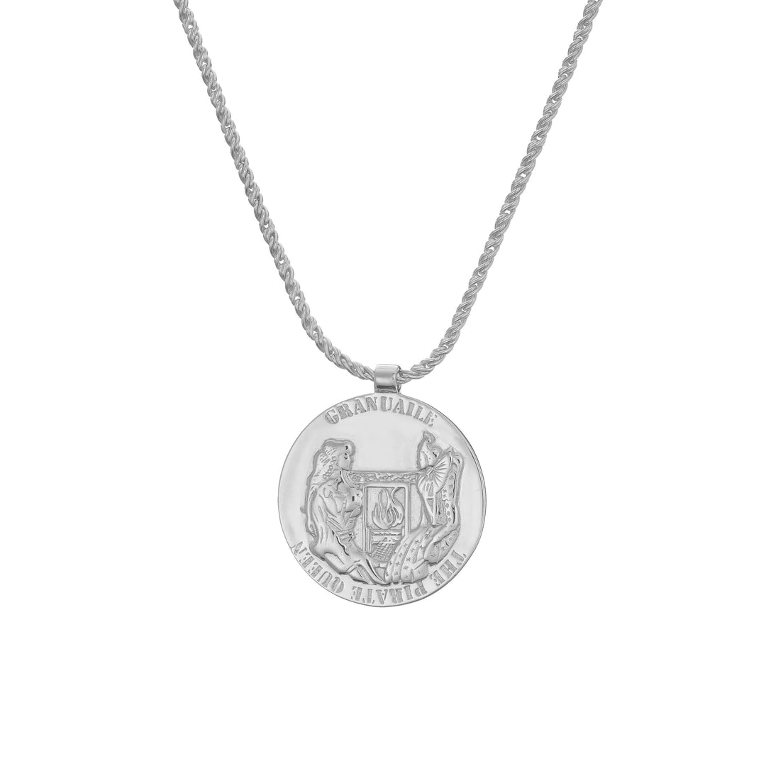 The Grace O'Malley Medallion Small by Jennifer Kinnear is a silver necklace featuring a round pendant with embossed designs of a lion and a unicorn flanking a shield, reminiscent of Queen Elizabeth I medallions. The chain showcases an elegant twisted rope pattern, all set against a plain white background.