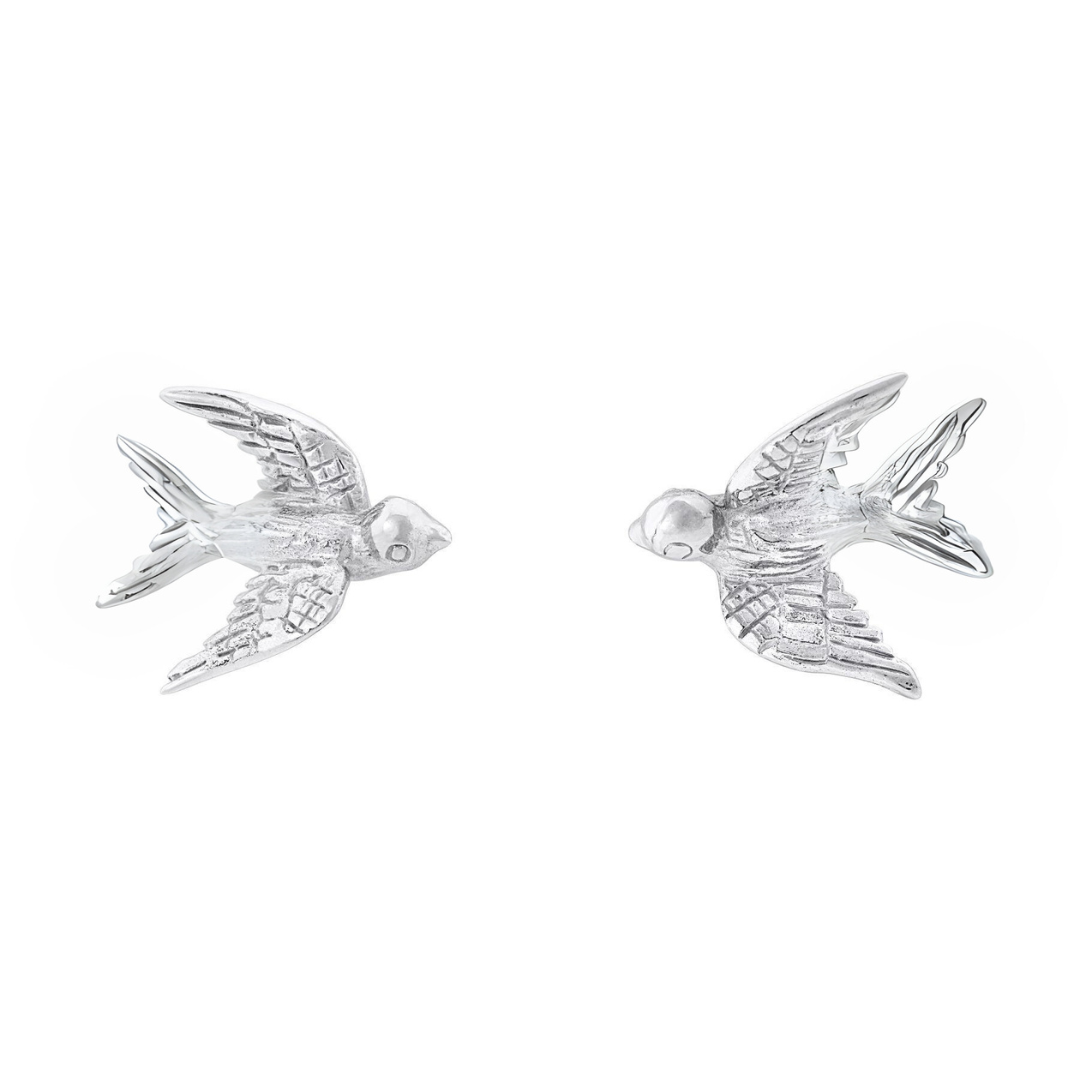 The Wildlife Swallow Studs by Gallardo & Blaine Designs feature two sterling silver earrings with feather-textured wings and tails, facing each other on a white background—a timeless piece of Irish jewellery.