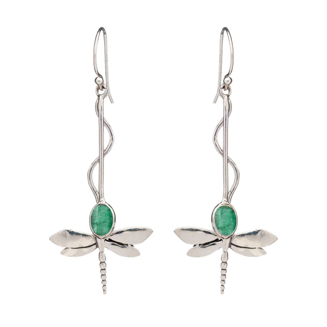 The Willow Earrings by Gallardo & Blaine Designs feature silver dragonflies with green oval gemstones as bodies, intricately detailed wings and tails, and elegant hook-style ear wires. Nature-inspired design—available in various gemstones.